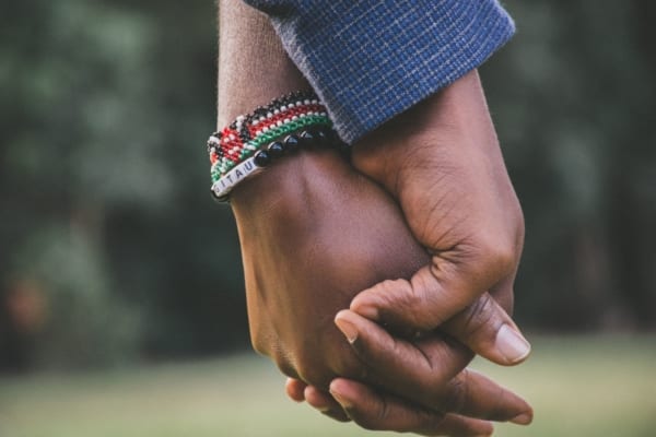 close-up-photo-of-two-person-s-holding-hands-1667849-min